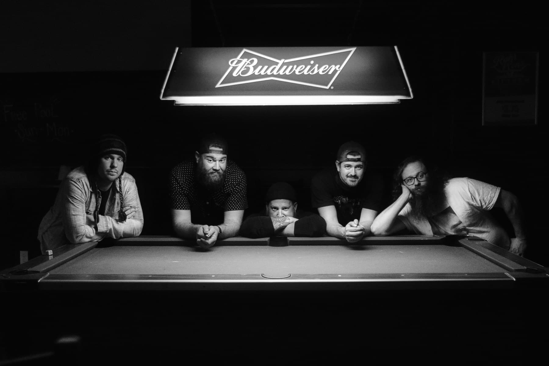 The Dick Beldings promotional portrait at a pool table